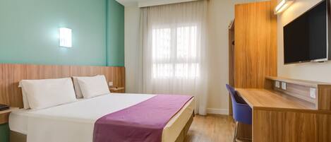 Standard Double Room | Minibar, in-room safe, desk, blackout drapes