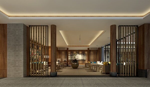 A modern lobby with a central seating area, wooden columns, and a large vase. - Holiday Inn Express - Zhejiang Qianxia Lake by IHG (Lishui)