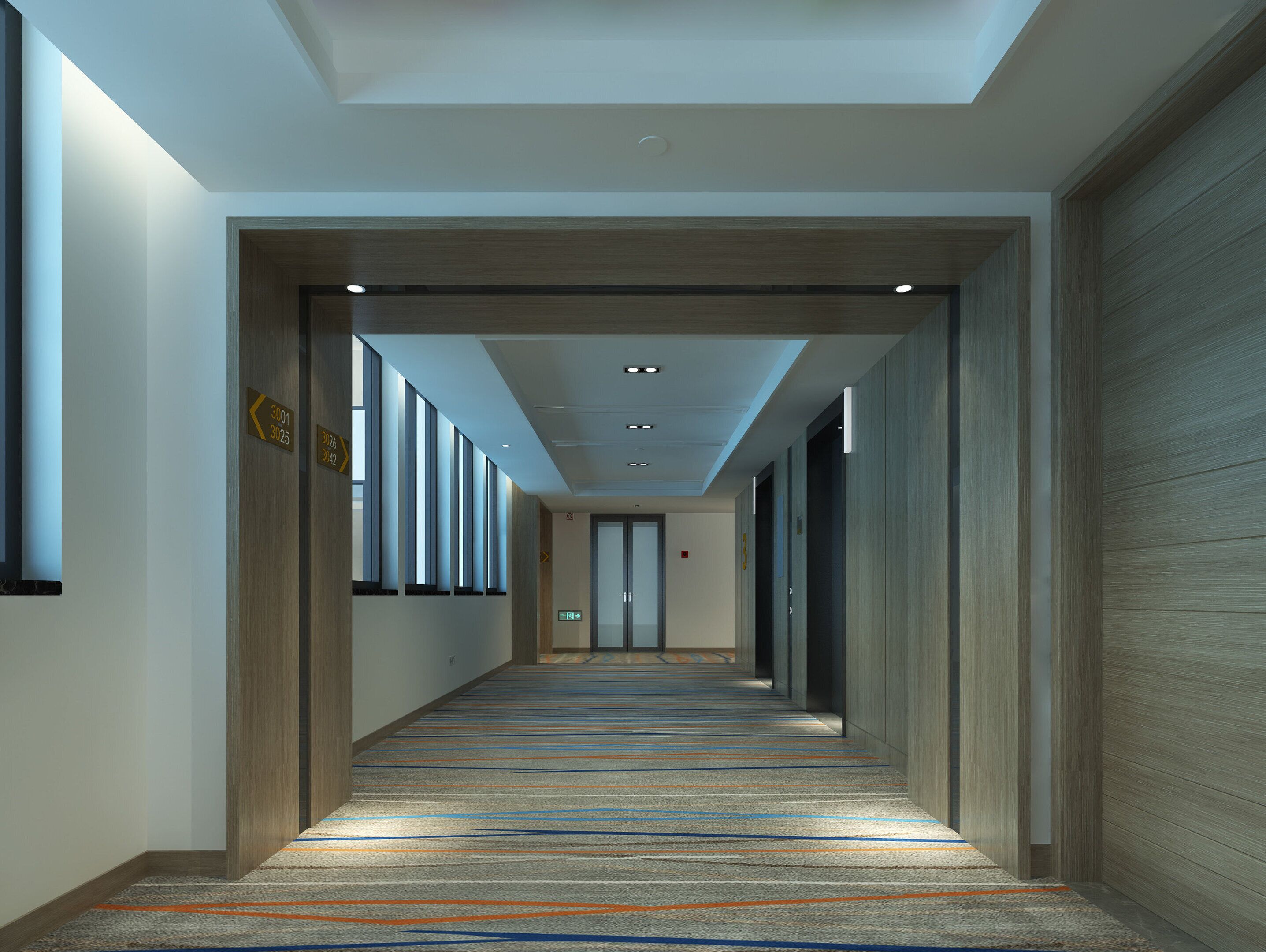 A long, narrow hallway with a patterned carpet, wooden paneling on the walls, and a ceiling with recessed lighting.
