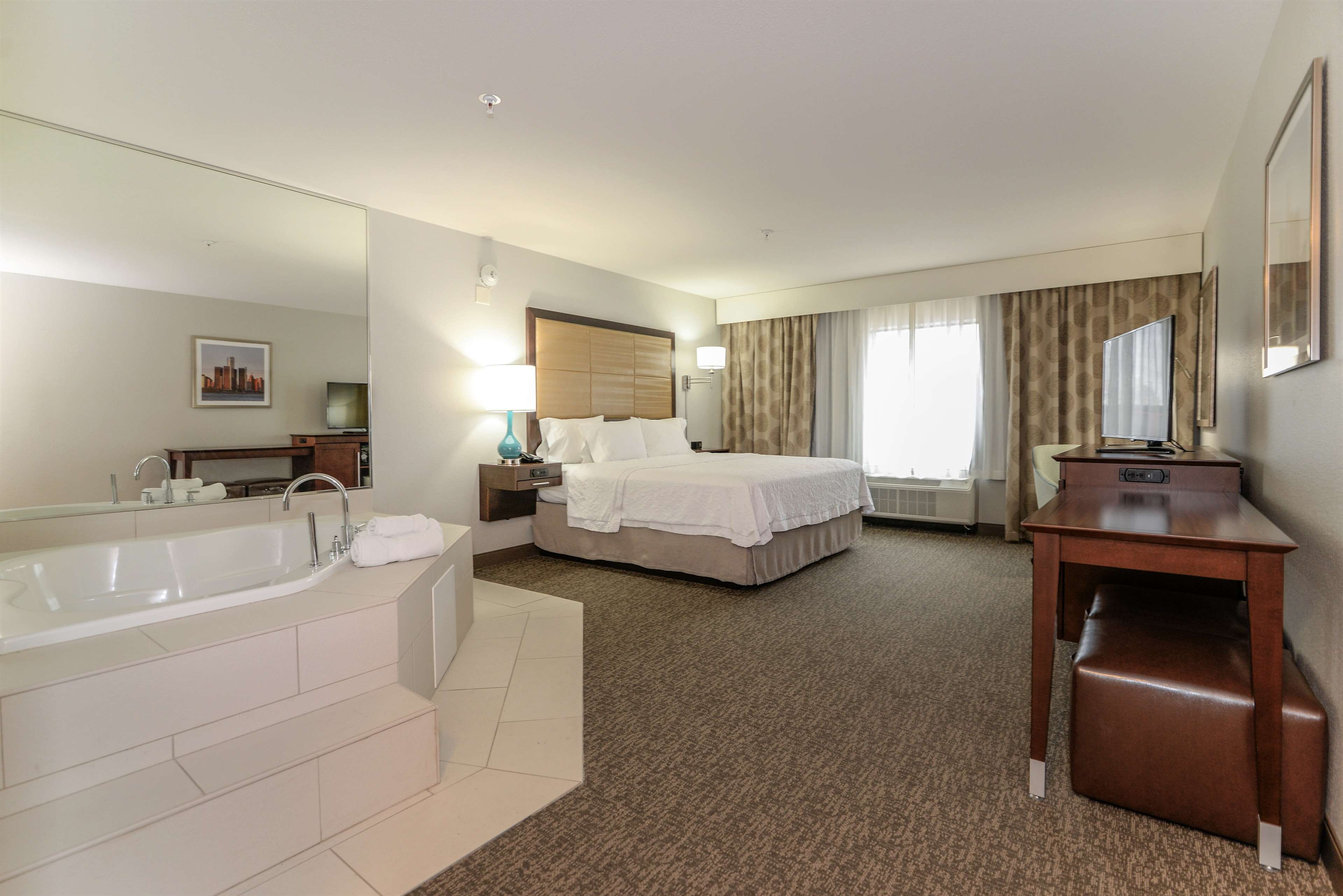 room, 1 king bed, jetted tub | bathroom | combined shower/bathtub, free toiletries, hair dryer, towels