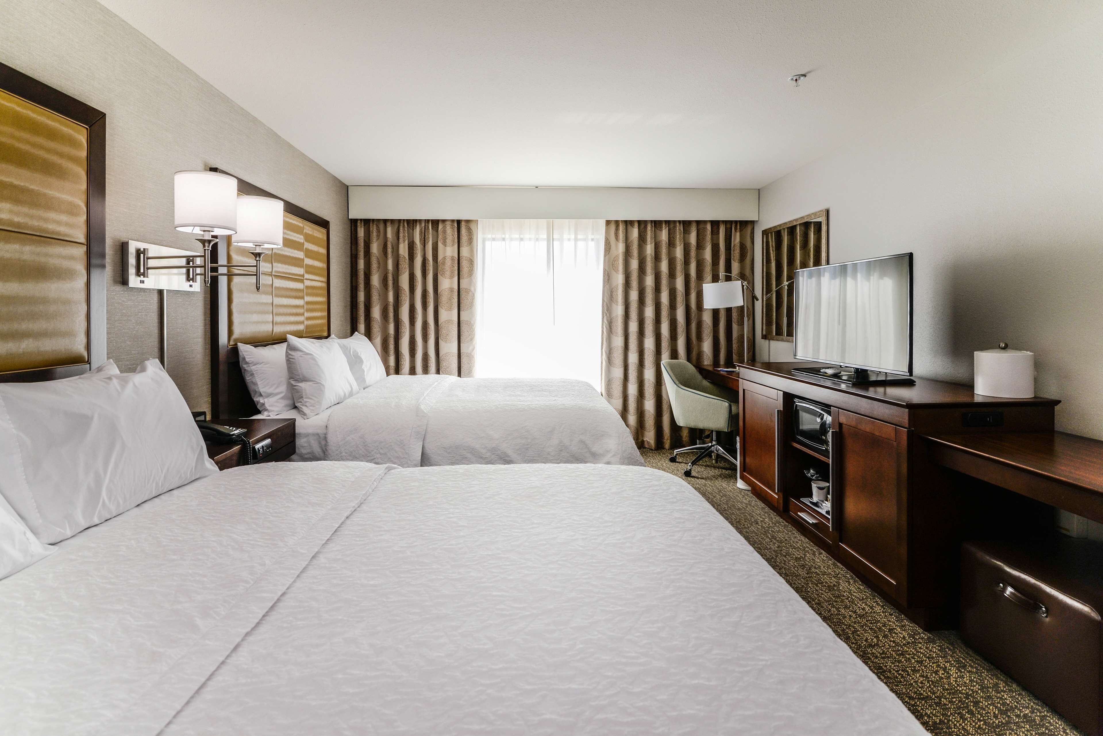 room, 2 queen beds, refrigerator & microwave | in-room safe, iron/ironing board, free cots/infant beds, free wifi