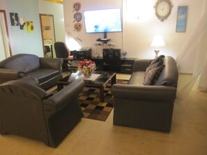 4 Bedroom House | Living room | 42-inch flat-screen TV with cable channels, TV, DVD player - Captain Cook Apartments (Nuku'alofa)