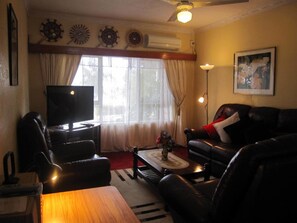 2 Bedroom Apartment | Living room | 42-inch flat-screen TV with cable channels, TV, DVD player - Captain Cook Apartments (Nuku'alofa)