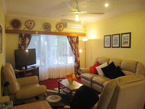 2 Bedroom Apartment | Living room | 42-inch flat-screen TV with cable channels, TV, DVD player - Captain Cook Apartments (Nuku'alofa)