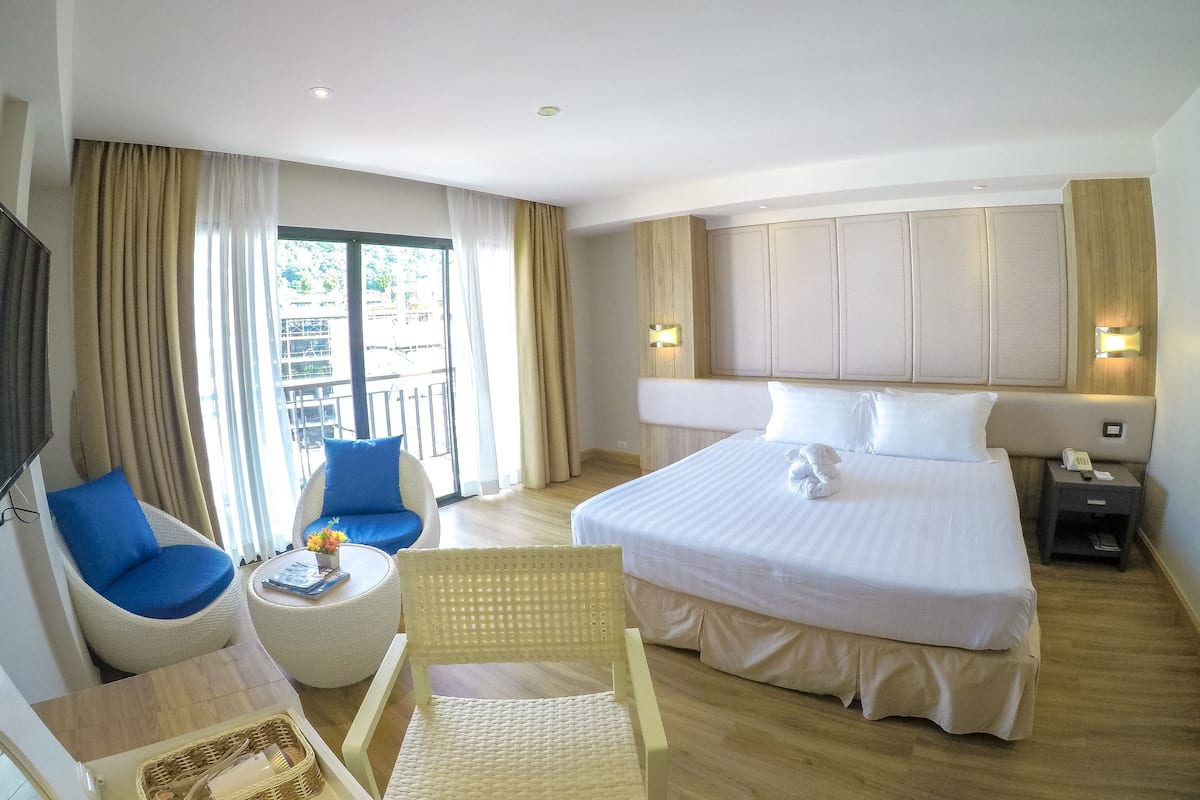 Deluxe Room, 1 Queen Bed, Partial Sea View | In-room safe, desk, free WiFi, bed sheets