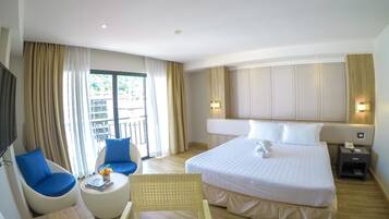 Deluxe Room, 1 Queen Bed, Partial Sea View | In-room safe, desk, free WiFi, bed sheets