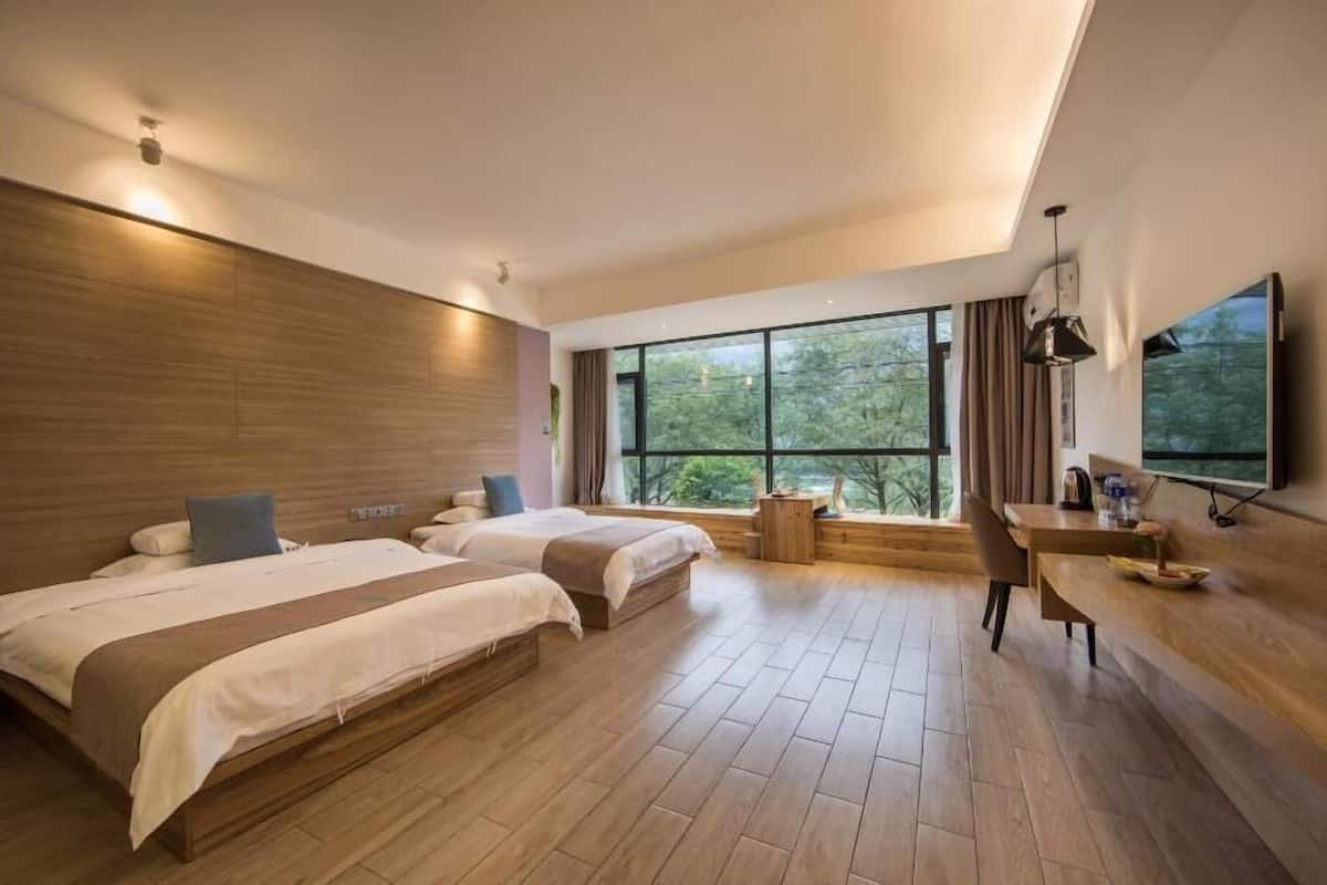 superior family room, mountain view | premium bedding, down duvets, memory-foam beds, in-room safe