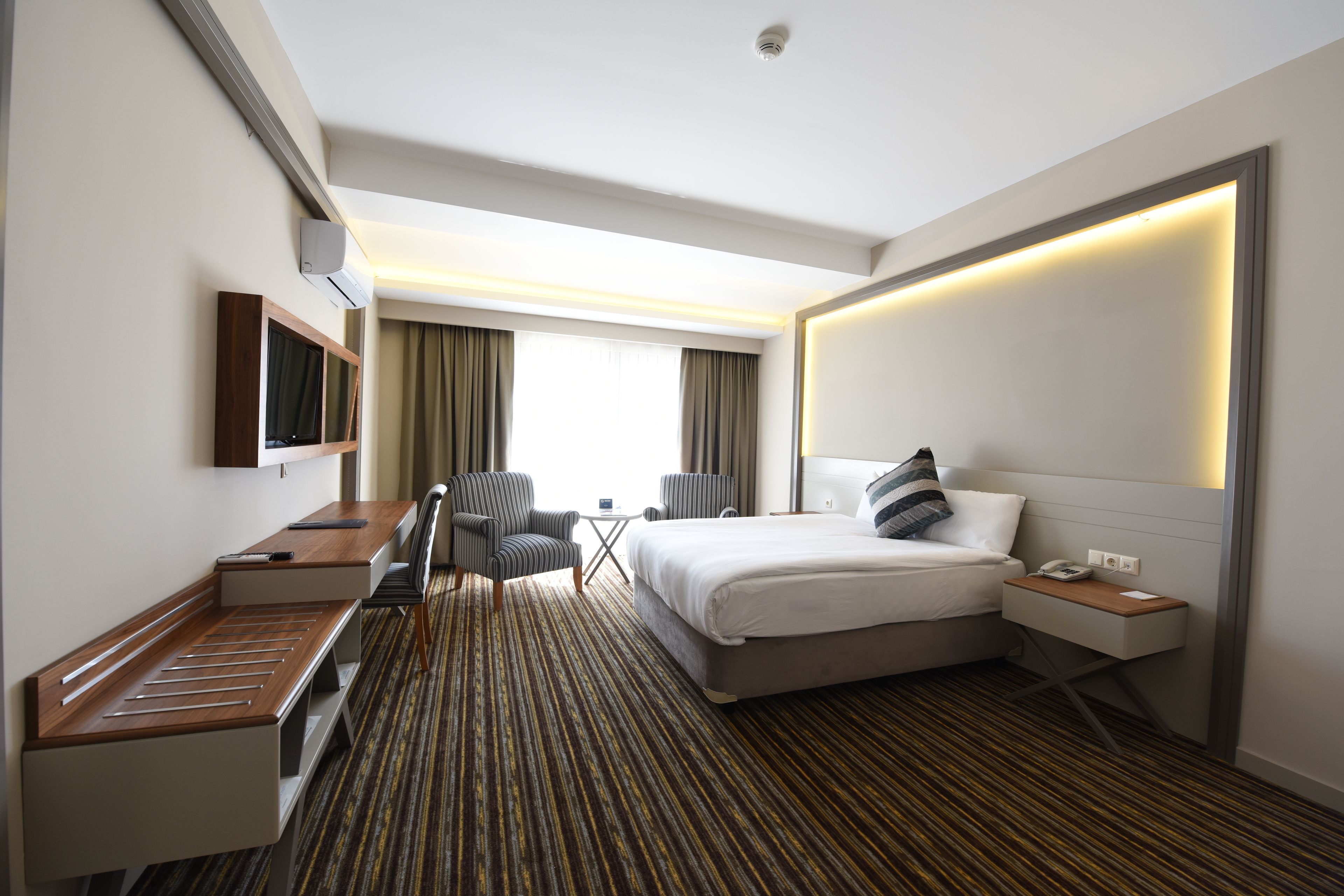deluxe room | premium bedding, desk, soundproofing, free wifi