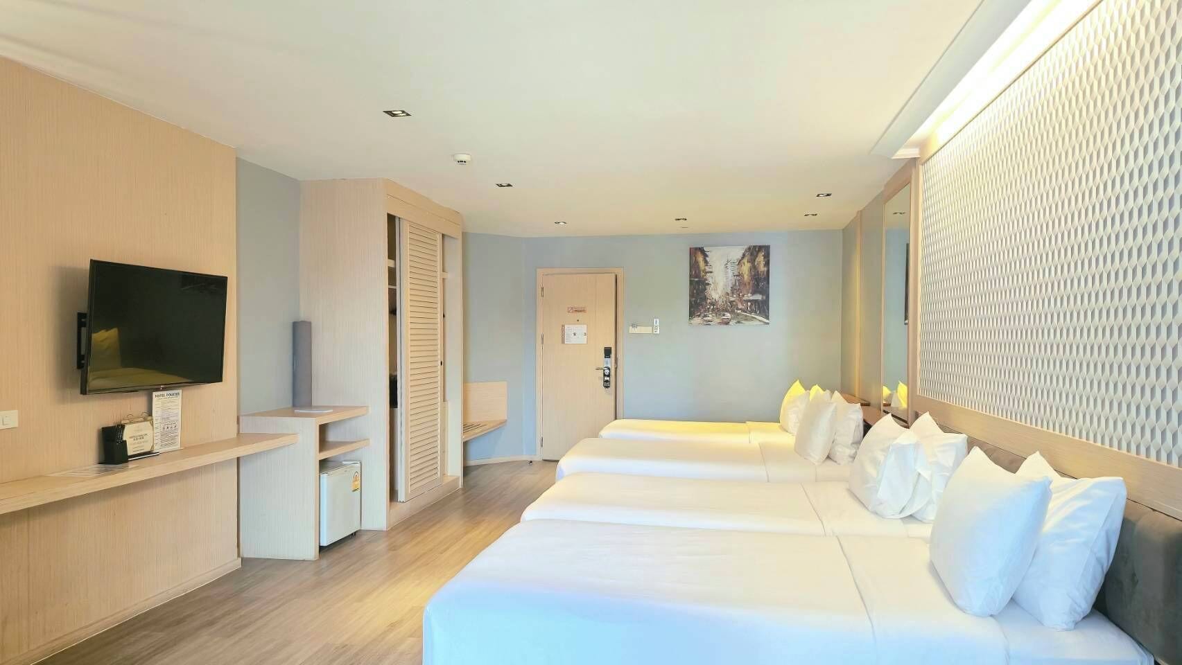 Habitación cuádruple | Caja de seguridad en la habitación, cortinas blackout y wifi gratis 