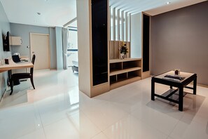 Deluxe Double Room | Living area | 43-inch LED TV with cable channels, TV