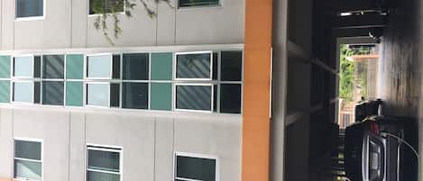 A multi-story building with a parking garage.