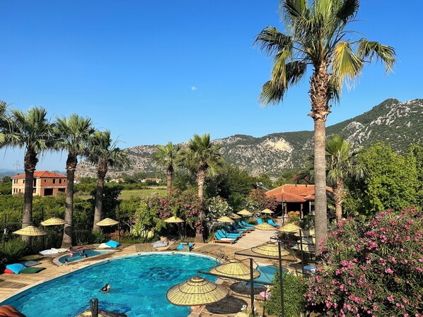 Seasonal outdoor pool, pool umbrellas, sun loungers
