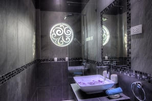 A modern bathroom with a large mirror, a vessel sink, and a shower area. - Tropicale Villa (Rawai)
