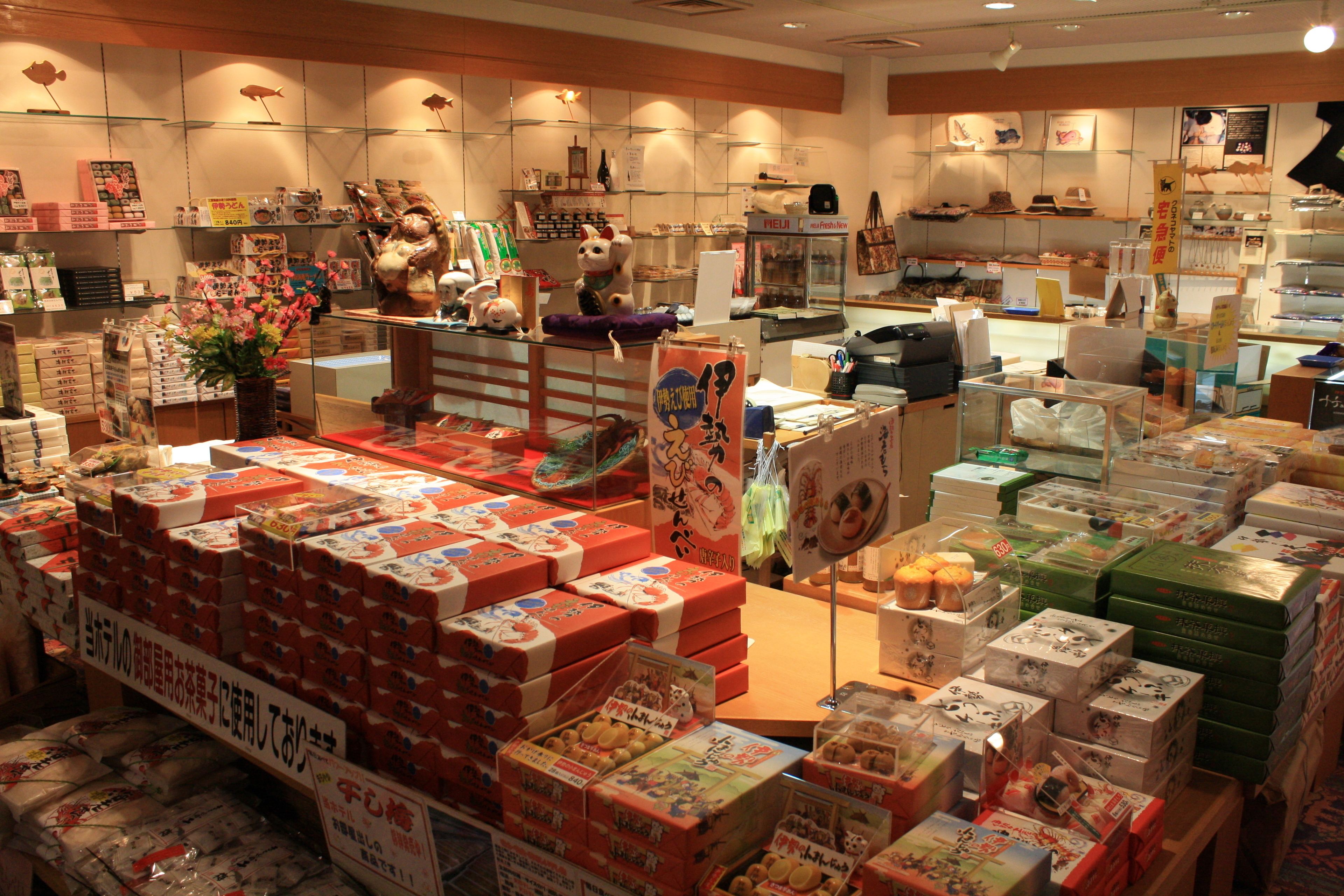 A store with various packaged goods and a display of stuffed animals.