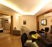 Presidential Suite | Living area | 22-inch LCD TV with satellite channels, TV