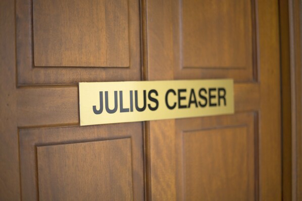 A wooden door with a sign that reads "JULIUS CEASER". - Mokorro Hotel (Chingola)