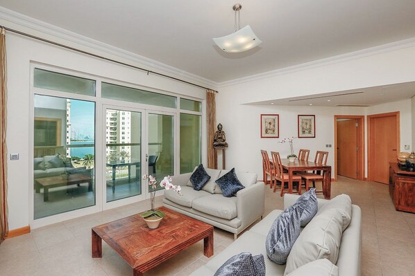 Apartment, 2 Queen Beds, Balcony | Living area | TV - Kennedy Towers - Al Anbara (Dubai)