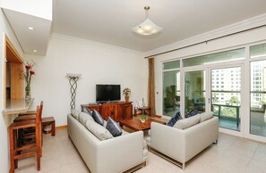 Apartment, 2 Queen Beds, Balcony | Living area | TV - Kennedy Towers - Al Anbara (Dubai)