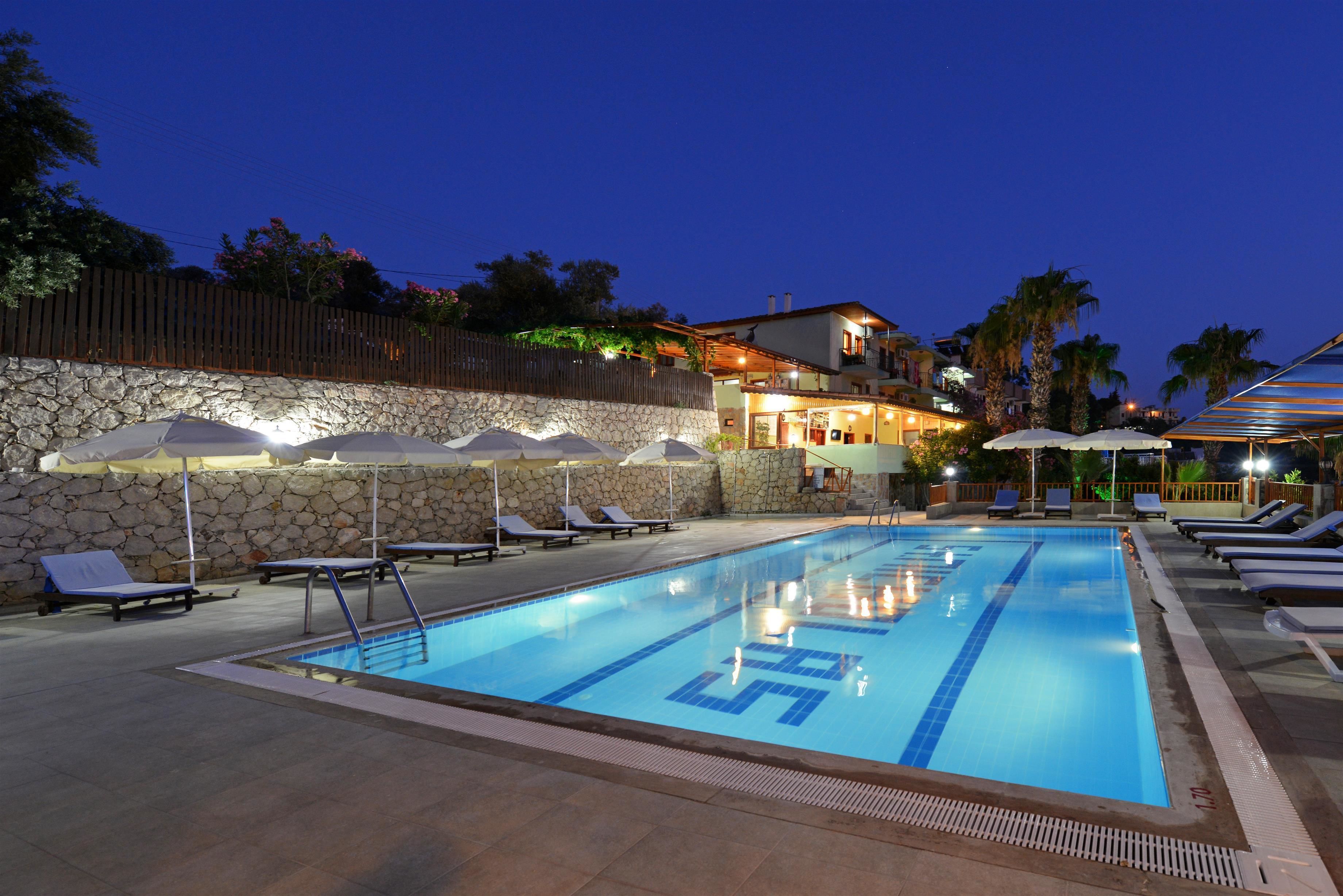 outdoor pool, pool umbrellas, pool loungers