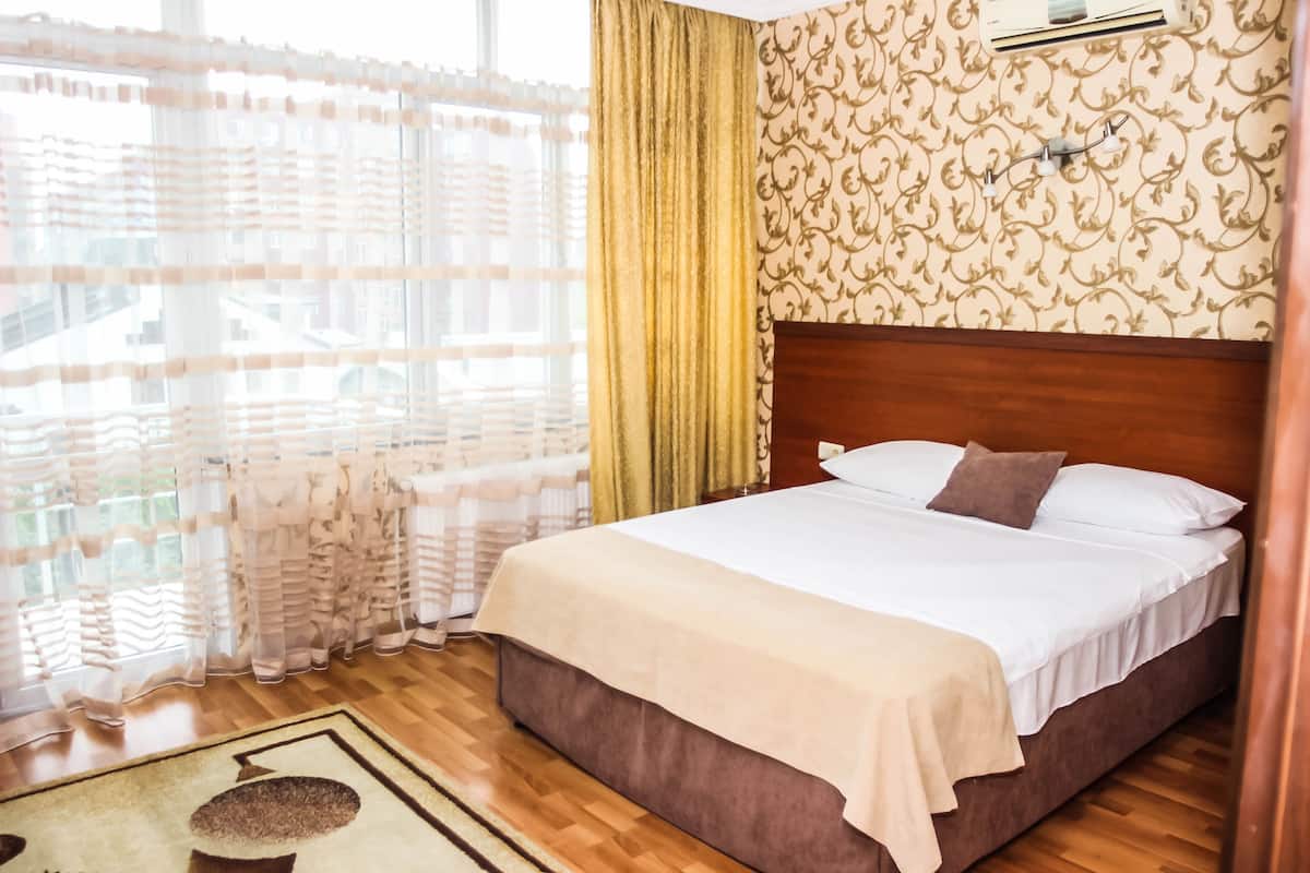 Suite | Minibar, tabla de planchar con plancha, camas extra y wifi gratis