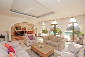 Villa, 4 Bedrooms | Living area | Flat-screen TV - Kennedy Towers - Frond F Villa (Dubai)