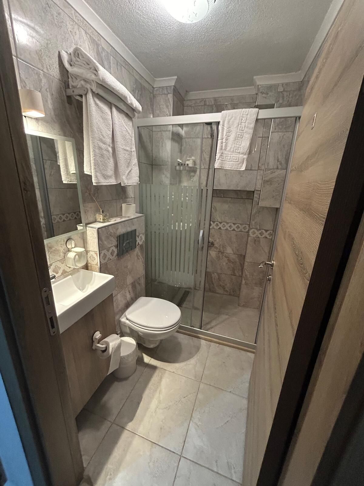 economy double room, basement, no view | bathroom | shower, free toiletries, hair dryer, slippers