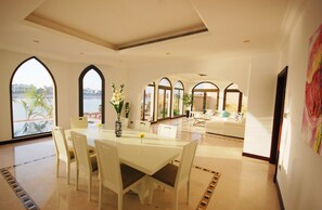 Villa, 5 Bedrooms | Living area | Flat-screen TV - Kennedy Towers - Frond L Garden Home (Dubai)
