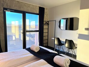 2 bedrooms, desk, blackout drapes, soundproofing