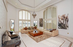Villa, 4 Bedrooms, Private Pool | Living area | Flat-screen TV - Kennedy Towers - Frond M Villa (Dubai)
