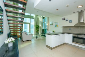 Basic Apartment, 1 Queen Bed, Pool Access | Private kitchen | Fridge, microwave - E&T Holiday Homes - Liberty House (Dubai)