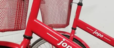 A red bicycle with the brand name "jopo" on the frame.