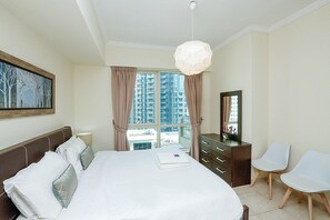 Apartment, 1 Bedroom | 1 bedroom, in-room safe, blackout curtains, iron/ironing board - Kennedy Towers - Al Majara (Dubai)