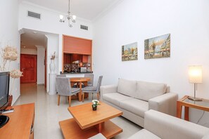 Appartement, 1 slaapkamer | Woonruimte | Een televisie