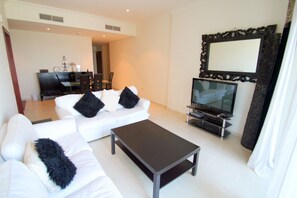 Departamento, 1 habitación | Área de sala de estar | Televisión 