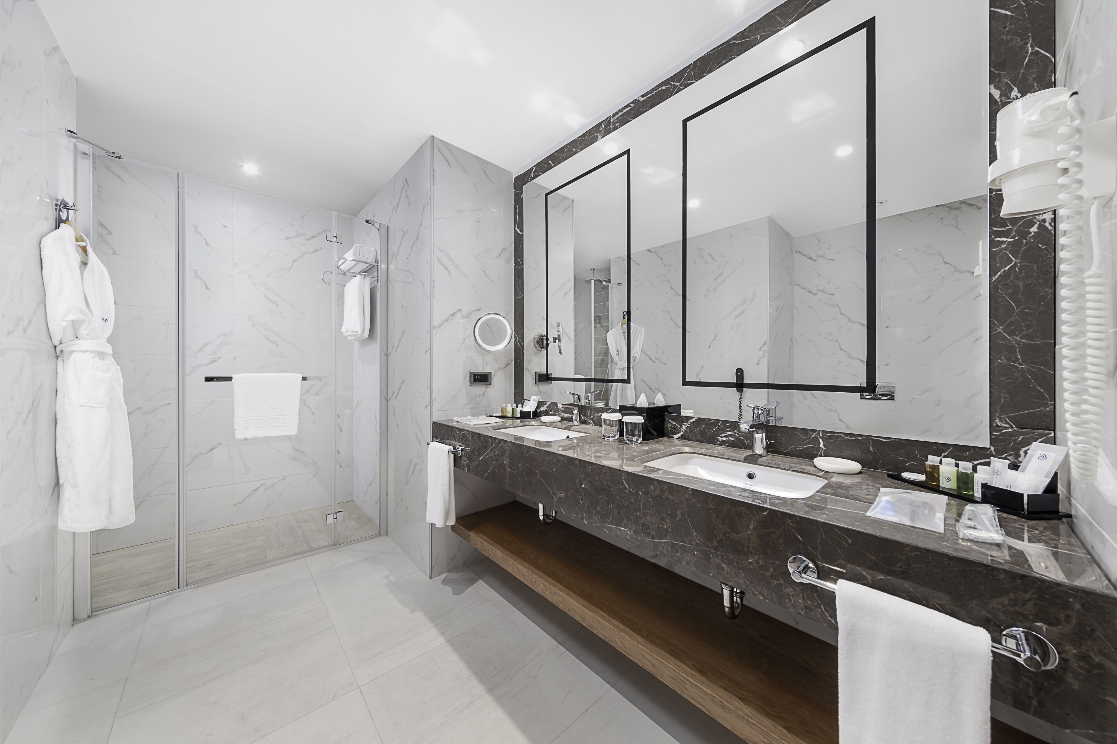 junior suite | bathroom | shower, eco-friendly toiletries, hair dryer, slippers