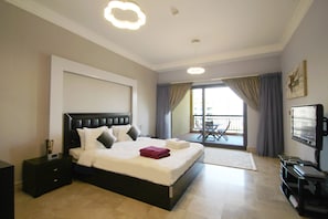 Apartment, 1 Queen Bed, Balcony | 1 bedroom, in-room safe, iron/ironing board, free WiFi
