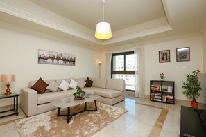 Apartment, 1 Bedroom | Living area | TV - Kennedy Towers - Fairmont South (Dubai)