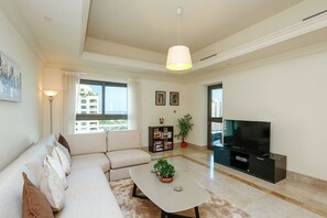 Apartment, 1 Bedroom | Living area | TV - Kennedy Towers - Fairmont South (Dubai)