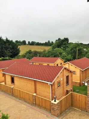 Set amidst green fields and trees, this charming residential area offers a serene rural retreat.