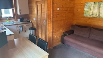 Standard Double Room | Living area | Flat-screen TV