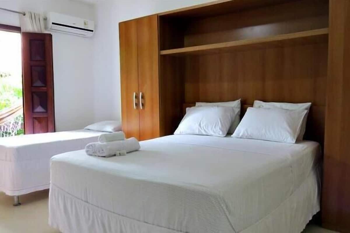 Desk, blackout drapes, bed sheets