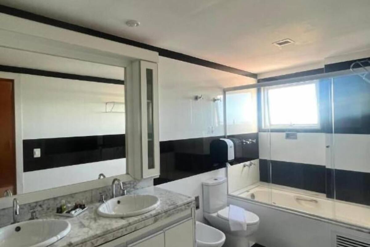 deluxe suite, jetted tub | bathroom | shower, designer toiletries, hair dryer, towels