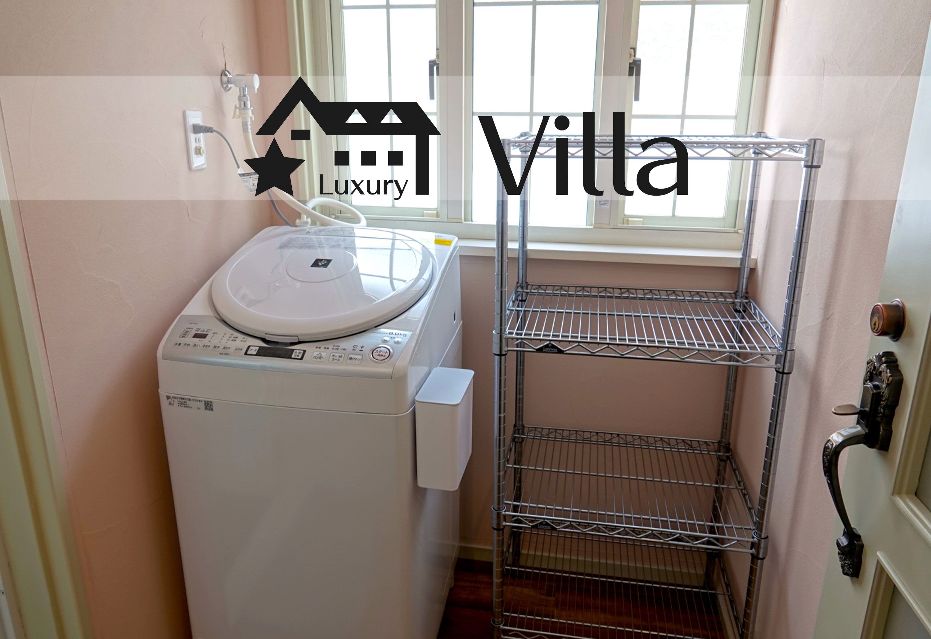 A compact laundry area with a washing machine, a metal shelf unit, and a window providing natural light.