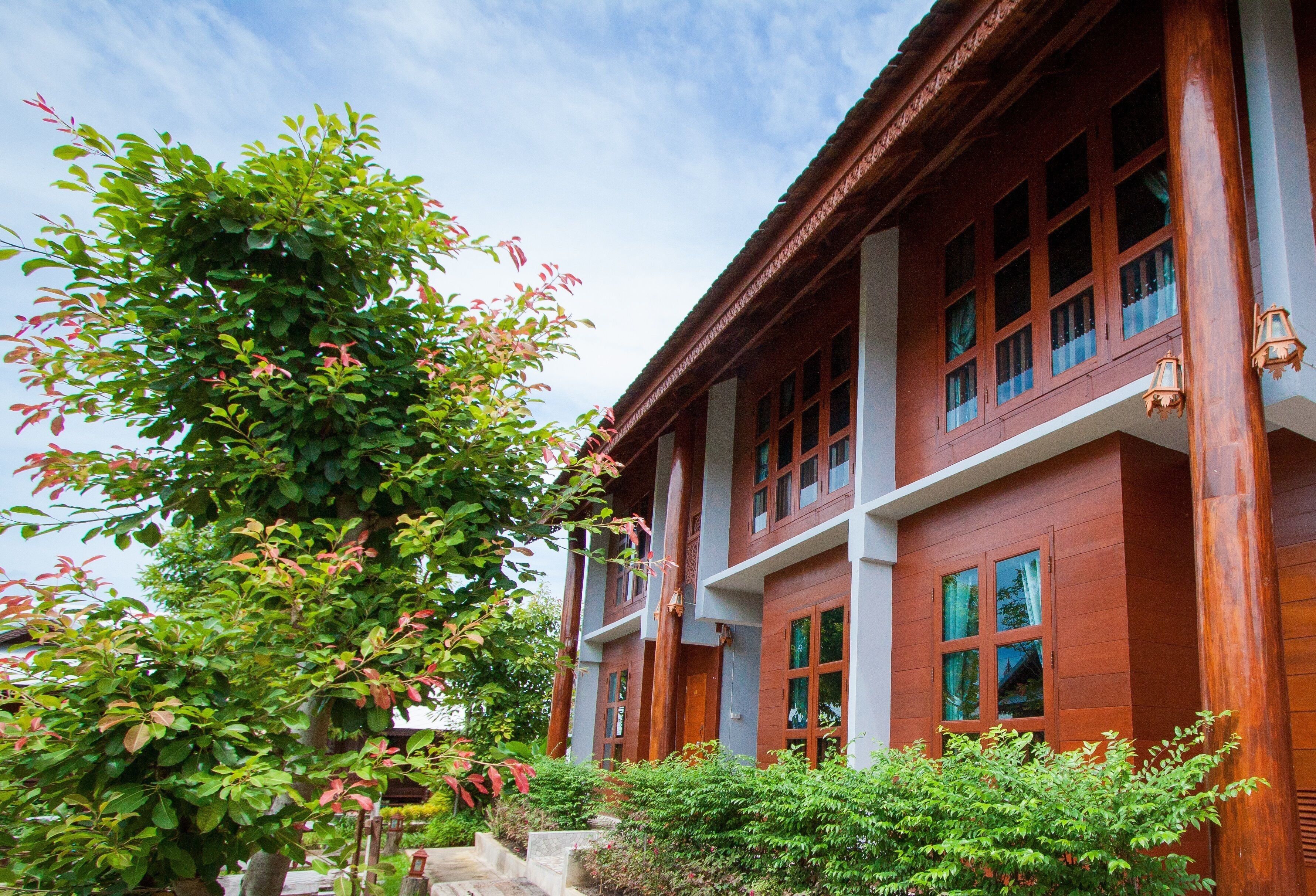 A traditional wooden building with multiple windows and balconies.