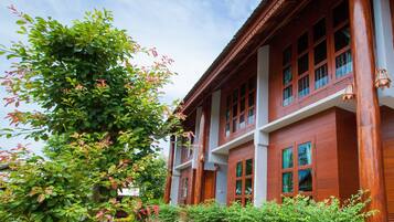 A traditional wooden building with multiple windows and balconies.