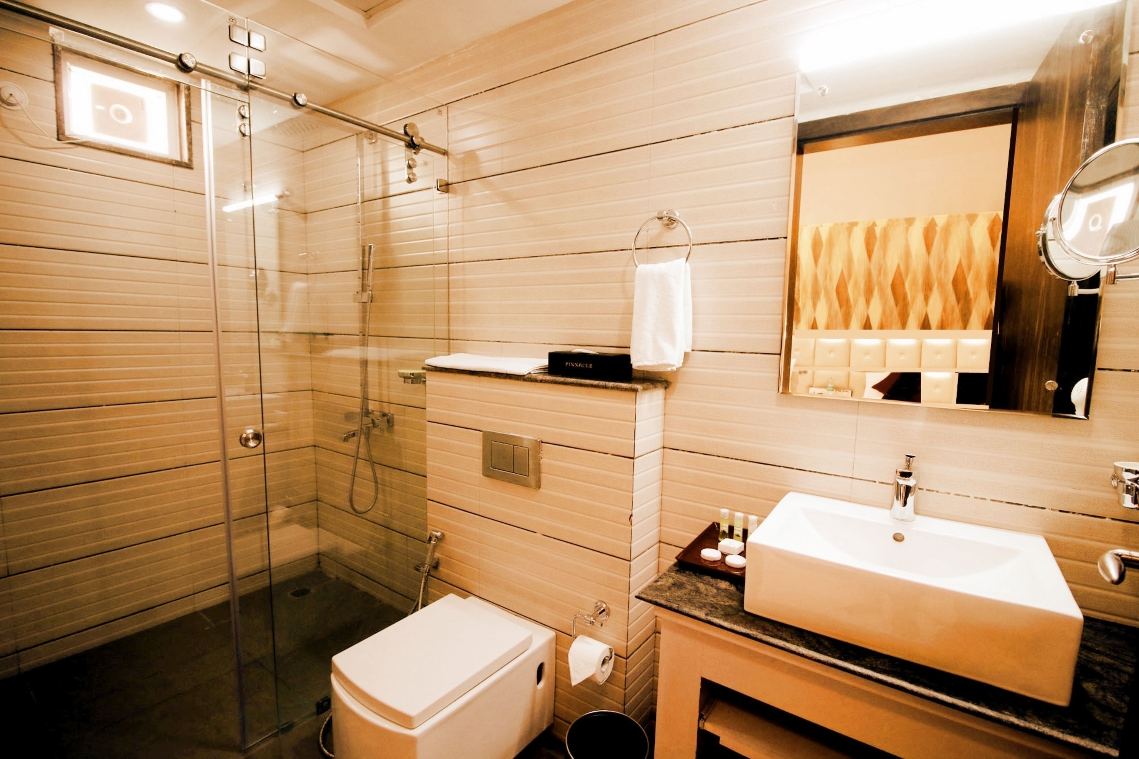 executive double room | bathroom | shower, free toiletries, hair dryer, towels