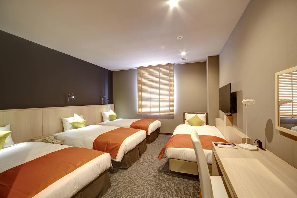 Family room/23sqm/Main Building (Non-Smoking) | Desk, blackout drapes, iron/ironing board (on request), WiFi (free)