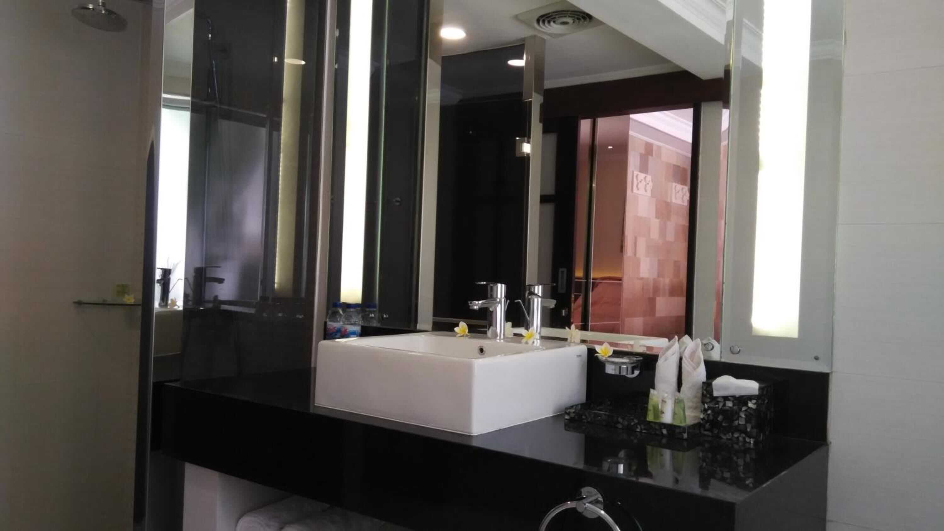 separate bathtub and shower, free toiletries, slippers, towels