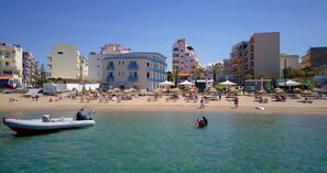 Enjoy stunning ocean views from your balcony, relax on the beach with sun loungers and umbrellas, and explore the sea with a nearby boat.