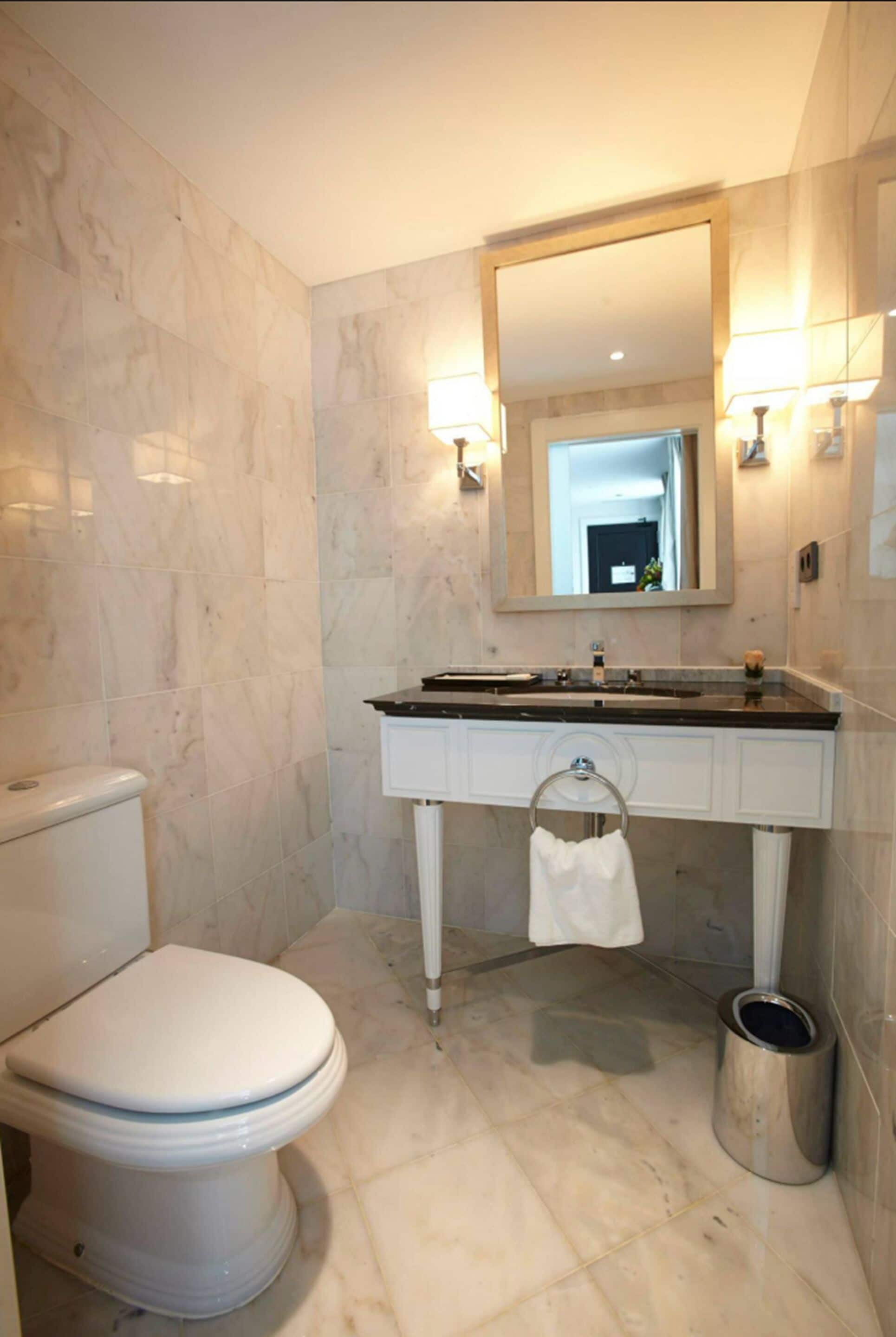 designer toiletries, hair dryer, bathrobes, slippers